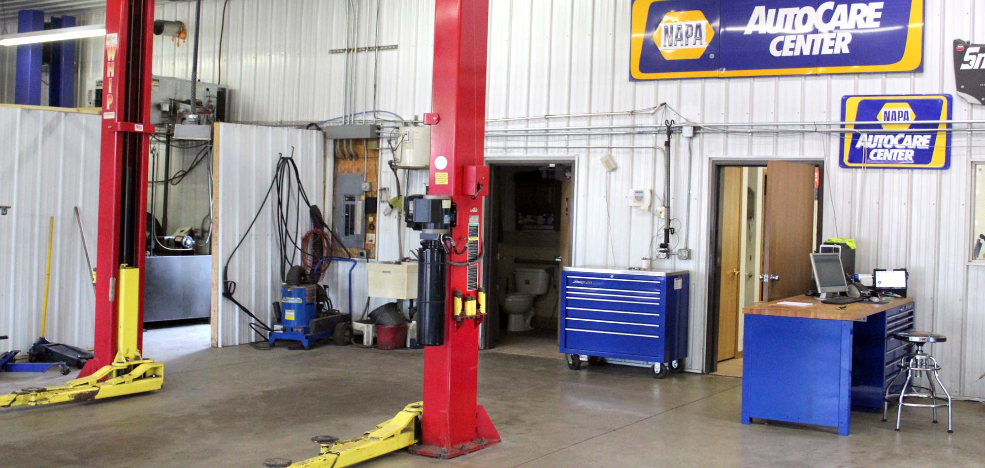 Auto lift and tools in the shop at Murphy's Auto Center